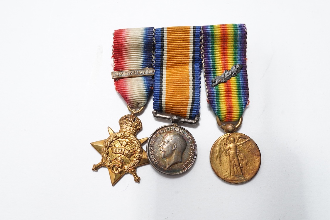 A First World War Mons Star trio awarded to Capt. A.D. Lowdell, with a clasp for 5th Aug-22nd Nov 1914, and oakleaf - mention in dispatches, together with the miniature set, plus a WWII Defence medal in its original card